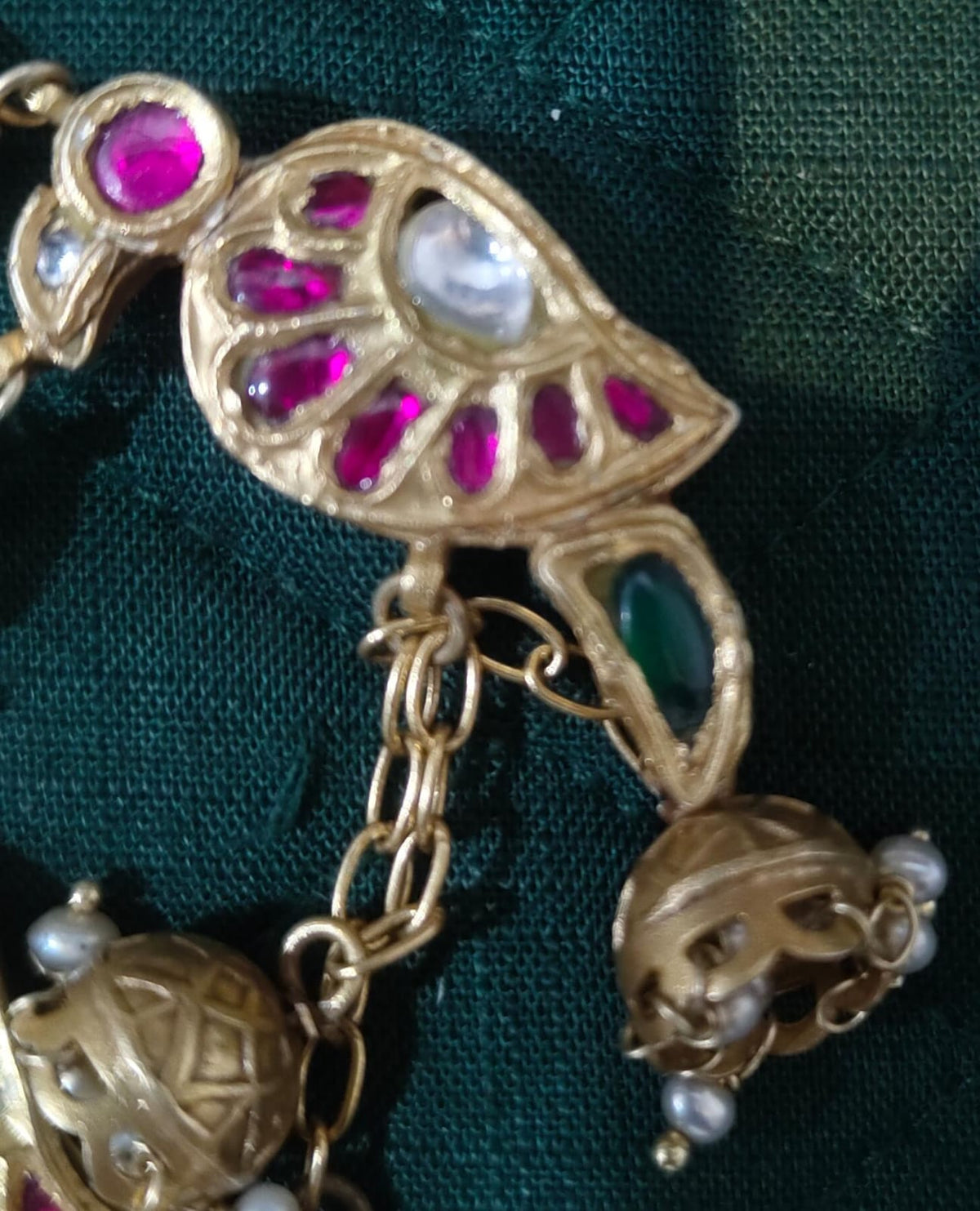 Parrot piece – bird-shaped decorative charm with coloured accents and hanging bells – My Motifs