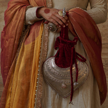 Handcrafted silver clutches and purses by Motifs
