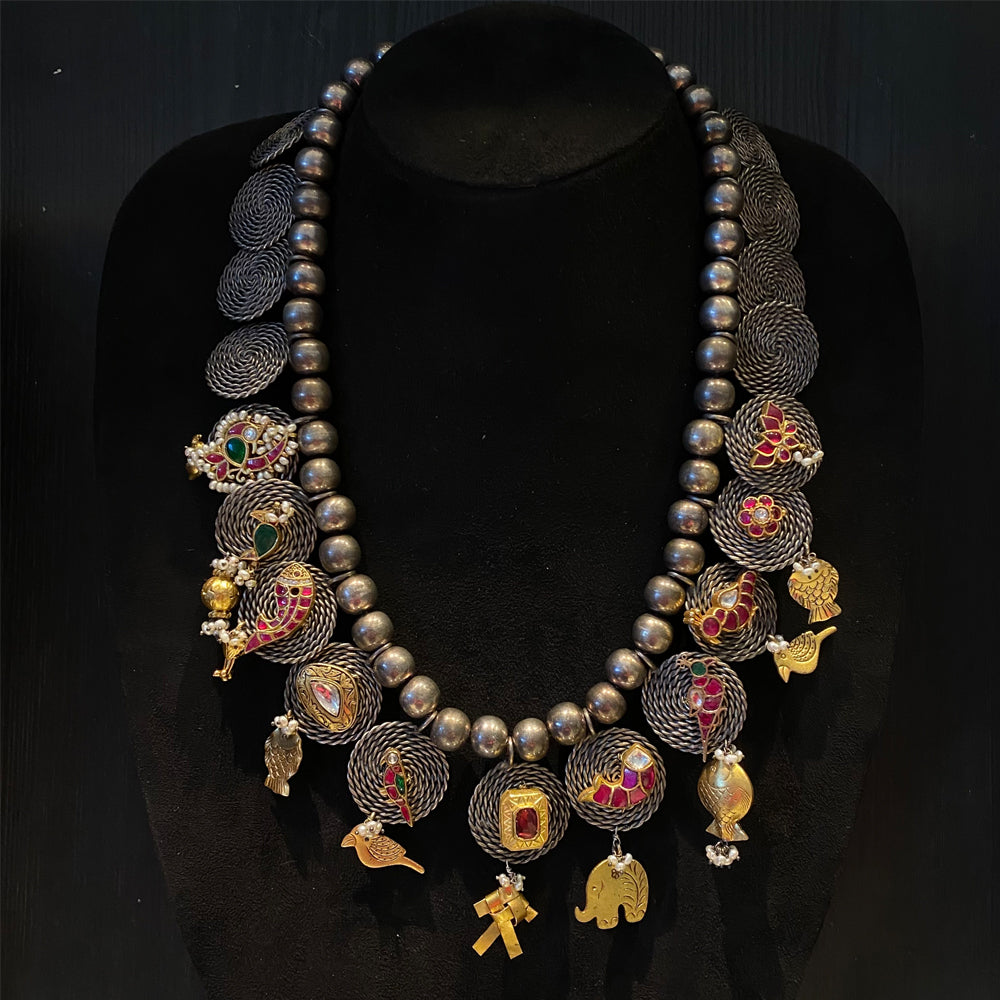 Yesha oxidised silver necklace with fish, parrot and peacock motifs