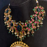 Uvana statement necklace showing emerald and semi-precious stone details