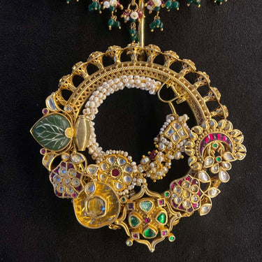 Close view of Uvana gold-tone kundan and pacheli silver necklace