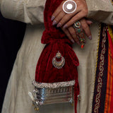 Ucchira woven silver potli purse with a dual-tone motif, bird detailing and tassel – My Motifs