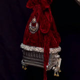Ucchira woven silver potli purse with a dual-tone motif, bird detailing and tassel, image 2 – My Motifs